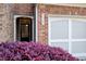 Close-up of the front entrance features beautiful landscaping and a well-lit entryway at 3365 Vintage Se Cir, Smyrna, GA 30080
