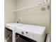 Conveniently located laundry room with modern washer and dryer and overhead storage at 3365 Vintage Se Cir, Smyrna, GA 30080