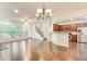 Bright living room with hardwood floors flowing into an open kitchen and staircase at 3365 Vintage Se Cir, Smyrna, GA 30080