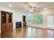 Cozy living room featuring a fireplace, built-in cabinets, and large windows for natural light at 3365 Vintage Se Cir, Smyrna, GA 30080
