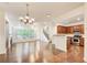 Bright and open living room featuring hardwood floors, a staircase, and a combined kitchen/dining area at 3365 Vintage Se Cir, Smyrna, GA 30080