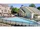 Community pool and clubhouse, surrounded by ample seating and lounge chairs at 3365 Vintage Se Cir, Smyrna, GA 30080