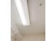 Brightly lit walk-in closet with a single shelf on the wall and painted in neutral shades at 3365 Vintage Se Cir, Smyrna, GA 30080