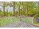 Back deck overlooking the lush, green backyard at 3839 Rosedale Ln, Douglasville, GA 30135