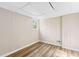Finished basement featuring wood-look flooring and a bright window at 3839 Rosedale Ln, Douglasville, GA 30135