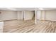 Finished basement area featuring wood-look flooring and access to the stairs at 3839 Rosedale Ln, Douglasville, GA 30135