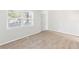 Bright bedroom featuring neutral walls, plush carpeting, and a large window at 3839 Rosedale Ln, Douglasville, GA 30135