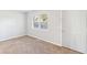 Cozy bedroom featuring neutral walls, plush carpeting, and a large window at 3839 Rosedale Ln, Douglasville, GA 30135
