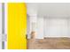 Bright entryway features a vibrant yellow door and neutral carpet, leading into the home at 3839 Rosedale Ln, Douglasville, GA 30135
