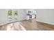 Open-concept living area with luxury vinyl plank flooring leading to the kitchen and a walkout deck at 3839 Rosedale Ln, Douglasville, GA 30135