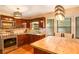 Bright kitchen features stainless steel appliances, granite countertops, and center island with breakfast bar at 484 Aberdeen Dr, Stonecrest, GA 30083