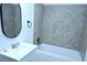Clean bathroom featuring a sink, vanity, and tiled shower-tub at 110 Ridge Se Ct, Mableton, GA 30126
