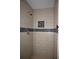 Updated bathroom with tile shower and decorative accent tile at 110 Ridge Se Ct, Mableton, GA 30126