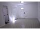 Bright bedroom with tile flooring, white walls, two doors, and a closet at 110 Ridge Se Ct, Mableton, GA 30126