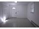 Well-lit bedroom with tile flooring, white walls, a door and closet at 110 Ridge Se Ct, Mableton, GA 30126