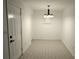 Dining room featuring neutral paint, tile floors, and a modern chandelier at 110 Ridge Se Ct, Mableton, GA 30126