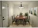 This dining room features neutral decor, a chandelier, and a dining table that seats six people at 110 Ridge Se Ct, Mableton, GA 30126