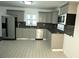 Updated kitchen with granite countertops, modern cabinets, tile backsplash, and stainless steel appliances at 110 Ridge Se Ct, Mableton, GA 30126