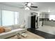 Bright living room open to the kitchen with stainless appliances and an adjacent living room area at 110 Ridge Se Ct, Mableton, GA 30126