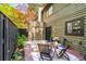 Inviting back patio featuring a dining set, privacy fence and beautiful green foliage at 2002 Cedar Chase Ne Ln, Atlanta, GA 30324