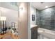 Stylish bathroom features a tub with glass enclosure and modern vanity at 2002 Cedar Chase Ne Ln, Atlanta, GA 30324