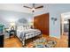 Spacious bedroom featuring hardwood floors, a ceiling fan, statement lighting, and built in wardrobe at 2002 Cedar Chase Ne Ln, Atlanta, GA 30324