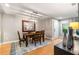 Elegant dining area features a wooden table, hardwood floors, a decorative chandelier, and stylish wall art at 2002 Cedar Chase Ne Ln, Atlanta, GA 30324