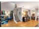 Bright entryway featuring hardwood floors, modern staircase with stylish railings, and tasteful decor leading to the living spaces at 2002 Cedar Chase Ne Ln, Atlanta, GA 30324