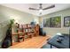 Functional home office with hardwood floors, shelving, natural light, and space for work and creativity at 2002 Cedar Chase Ne Ln, Atlanta, GA 30324