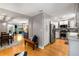 Open floorplan connects the dining area to a remodeled kitchen with stainless steel appliances and marble countertops at 2002 Cedar Chase Ne Ln, Atlanta, GA 30324