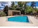 Community pool and clubhouse with ample seating and lounge chairs at 2002 Cedar Chase Ne Ln, Atlanta, GA 30324