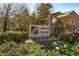 Cedar Chase: A private community entrance sign surrounded by lush greenery and flowers, signaling a welcoming neighborhood at 2002 Cedar Chase Ne Ln, Atlanta, GA 30324