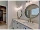 Elegant bathroom boasting a double vanity, marble countertops, modern fixtures, and walk-in closet at 3003 Evanshire Ave, Duluth, GA 30096