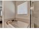 Elegant bathroom featuring large soaking tub and bronze fixtures at 3003 Evanshire Ave, Duluth, GA 30096