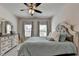 Bedroom featuring neutral paint, carpeted floor, large windows, ceiling fan, and a bed at 3003 Evanshire Ave, Duluth, GA 30096