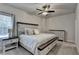 Bedroom featuring neutral paint, carpeted floor, large windows, ceiling fan, and a bed at 3003 Evanshire Ave, Duluth, GA 30096