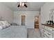 Bedroom featuring neutral paint, carpeted floor, large windows, ceiling fan, and a bed at 3003 Evanshire Ave, Duluth, GA 30096
