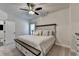 Bedroom featuring neutral paint, carpeted floor, large windows, ceiling fan, and a bed at 3003 Evanshire Ave, Duluth, GA 30096