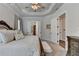 Bedroom featuring a large bed and an ensuite bathroom with a walk-in closet at 3003 Evanshire Ave, Duluth, GA 30096