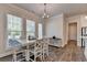 Bright dining area with modern lighting and convenient access to the adjacent kitchen, perfect for casual and formal dining at 3003 Evanshire Ave, Duluth, GA 30096