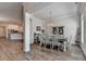 Charming dining room area featuring wood floors, stylish furnishings, and a view of the kitchen at 3003 Evanshire Ave, Duluth, GA 30096