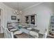 Cozy dining room with a farmhouse-style table, chandelier, and decorative shelving, ideal for intimate meals at 3003 Evanshire Ave, Duluth, GA 30096