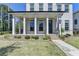 Inviting front porch with classic columns, brick steps, and charming details, creating a welcoming entrance at 3003 Evanshire Ave, Duluth, GA 30096