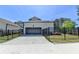 Detached garage features a spacious driveway and manicured landscaping at 3003 Evanshire Ave, Duluth, GA 30096
