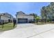 Detached garage features a spacious driveway and manicured landscaping at 3003 Evanshire Ave, Duluth, GA 30096