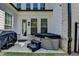 Back patio featuring a hot tub, grill, and manicured lawn at 3003 Evanshire Ave, Duluth, GA 30096