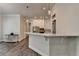 Kitchen island features stylish pendant lighting and quartz countertop at 3003 Evanshire Ave, Duluth, GA 30096