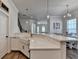 Kitchen with farmhouse sink, quartz countertops, stainless appliances and modern pendant lighting at 3003 Evanshire Ave, Duluth, GA 30096