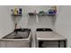 Modern laundry room equipped with front-load washer and dryer, plus ample storage space at 3003 Evanshire Ave, Duluth, GA 30096