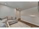 Upstairs living room with hardwood floors, abundant natural light, and comfortable seating at 3003 Evanshire Ave, Duluth, GA 30096